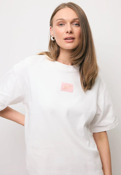 Kremowy T-shirt oversize z logo PARADISO
